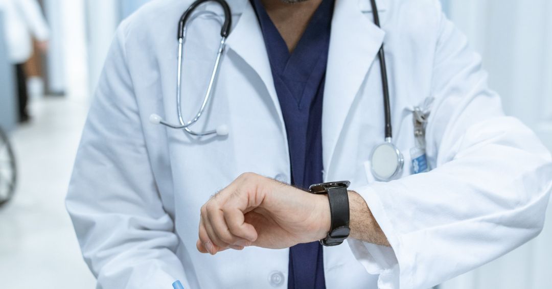 Doctor reviewing charting with an EMR