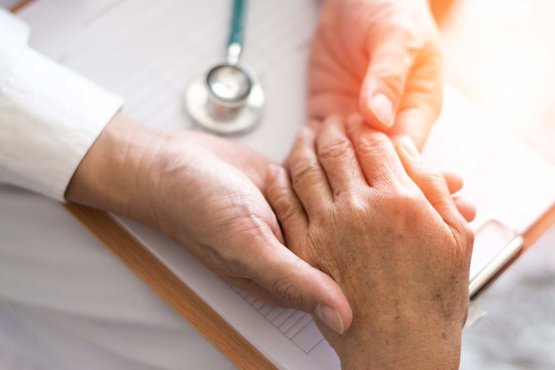 Patient with physician reviewing intake forms