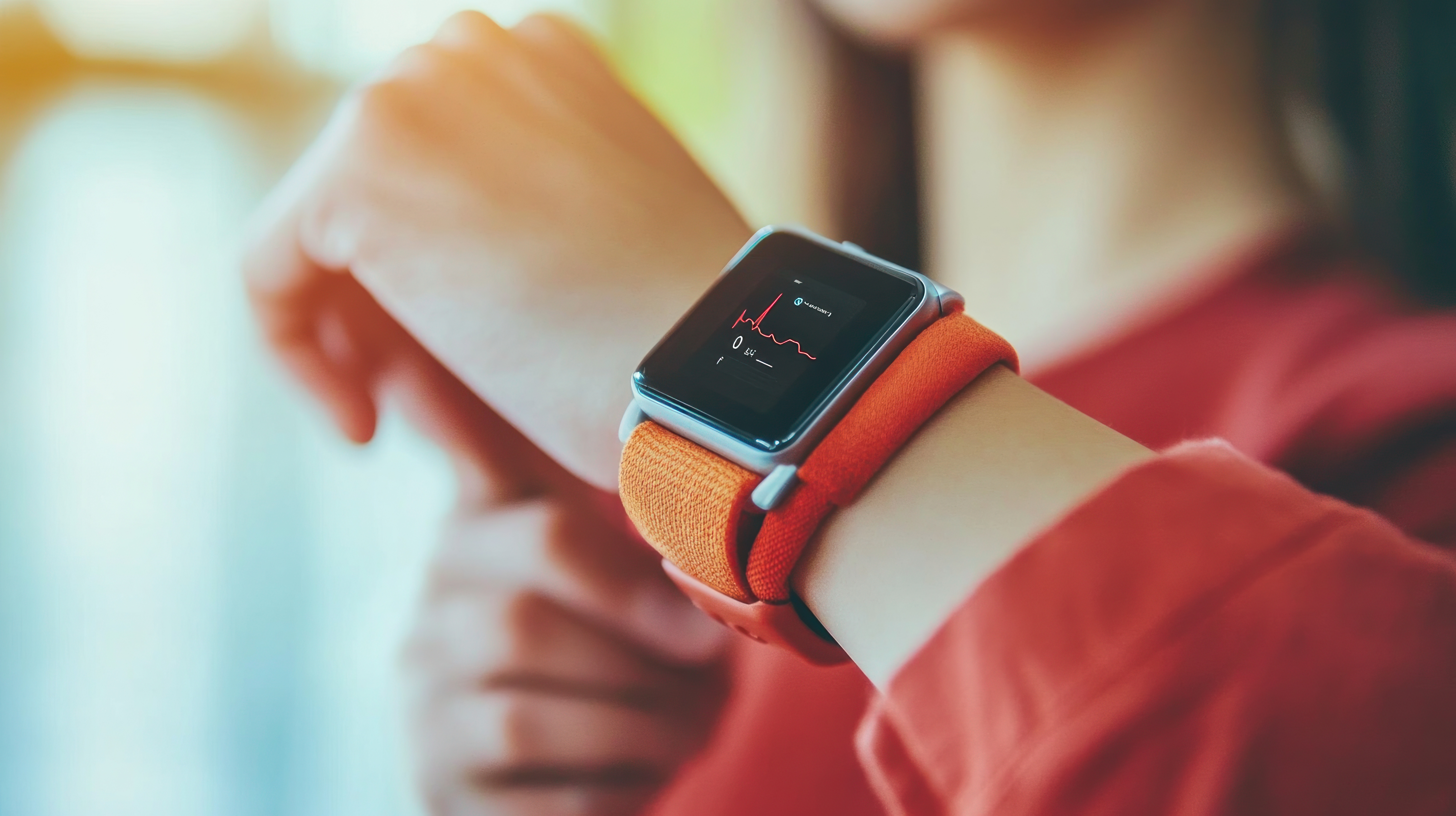 A smartwatch displaying a heart rate readout — continuous, real-world health data arriving at the exam room door