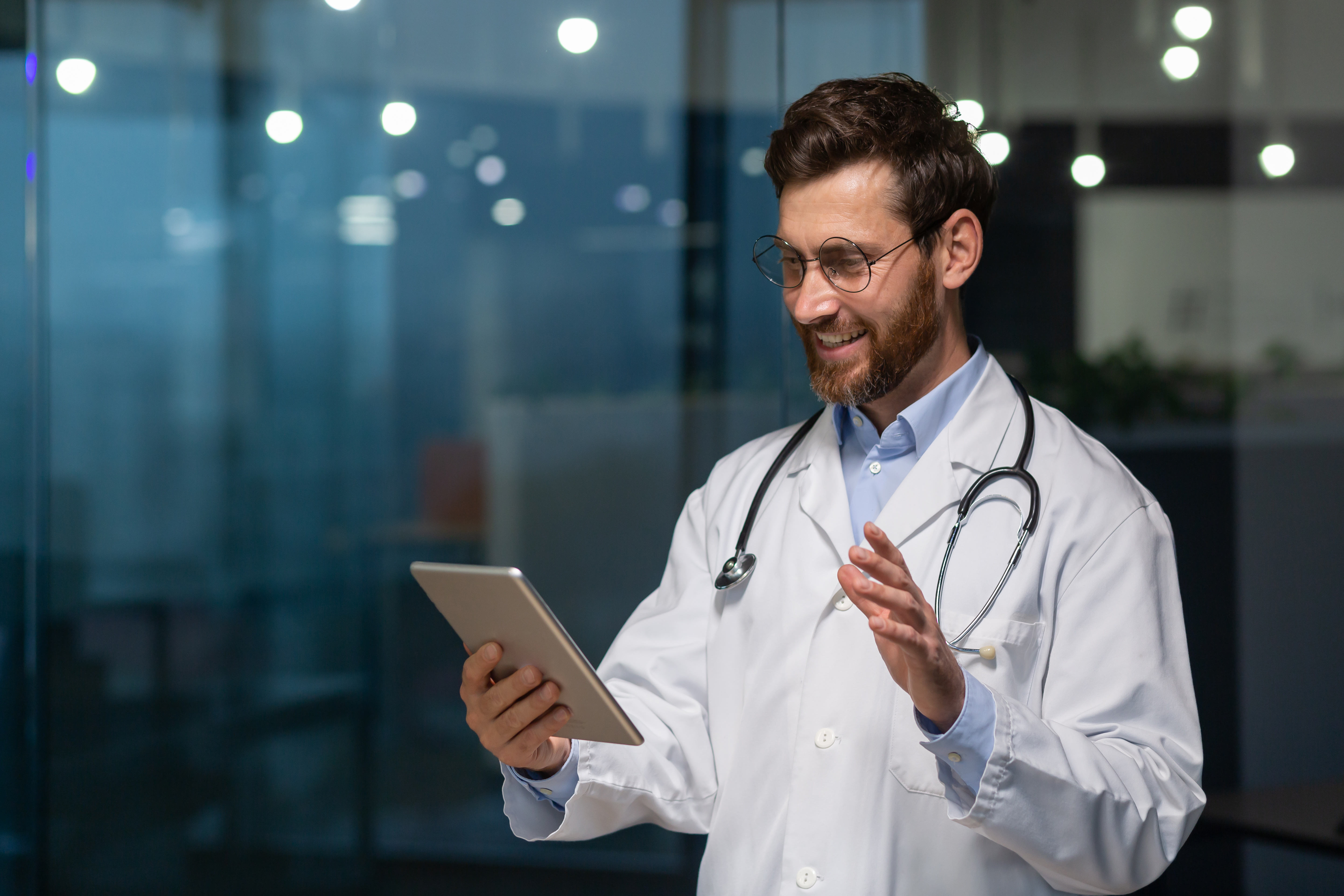 A confident physician evaluating software on a tablet